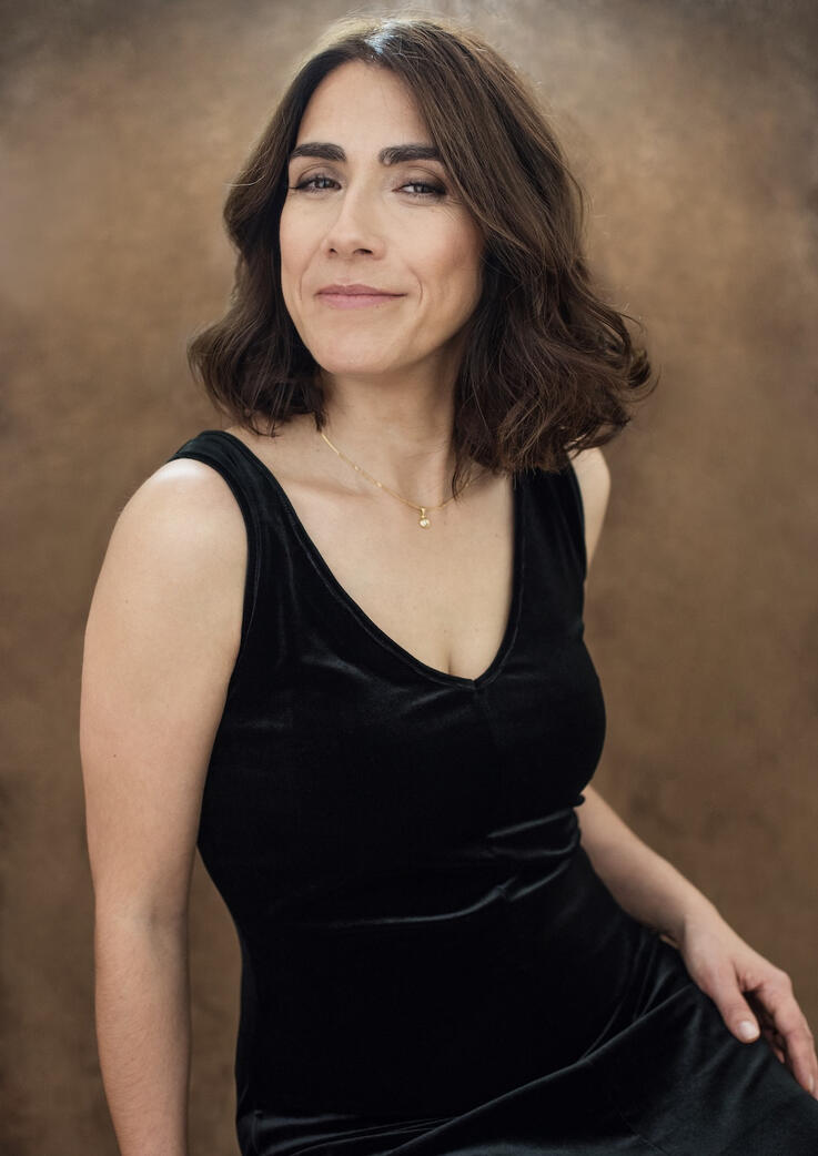 Photo of brunette woman in black velvet dress, Berlin studio photoshoot