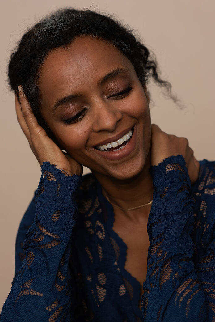 Photo of dark skin woman in blue lace, Berlin studio