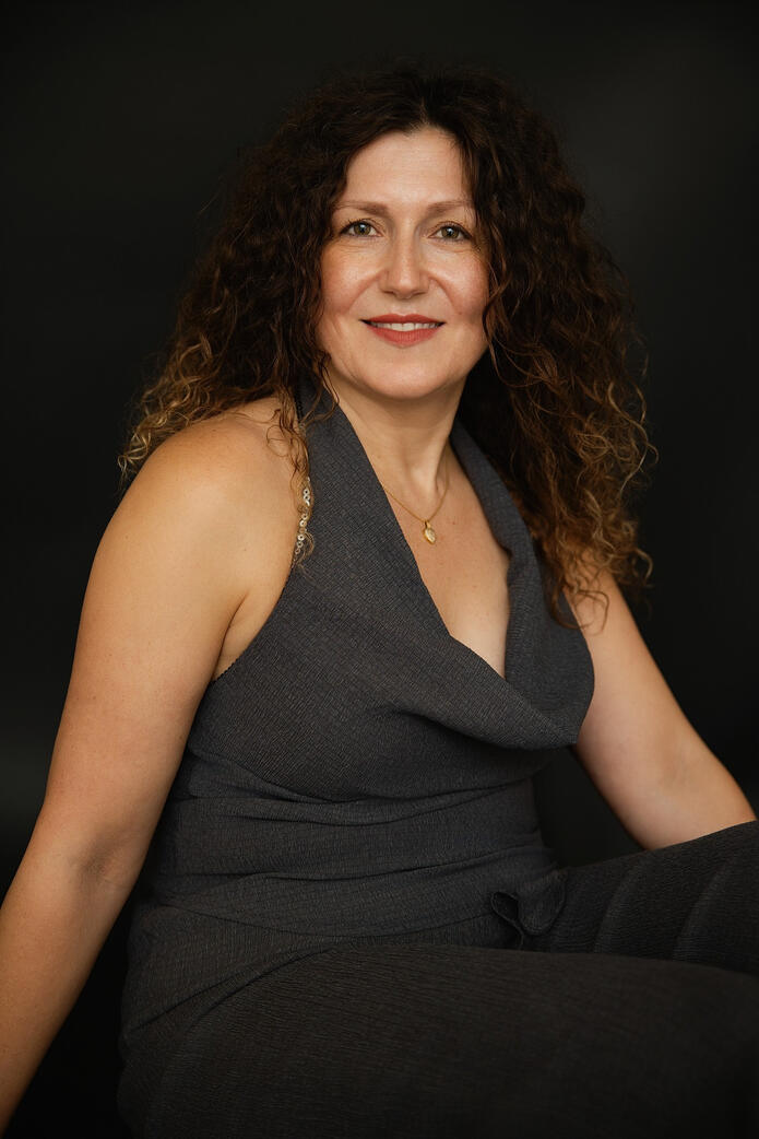 Photo of mid age woman in grey, Berlin studio photoshoot