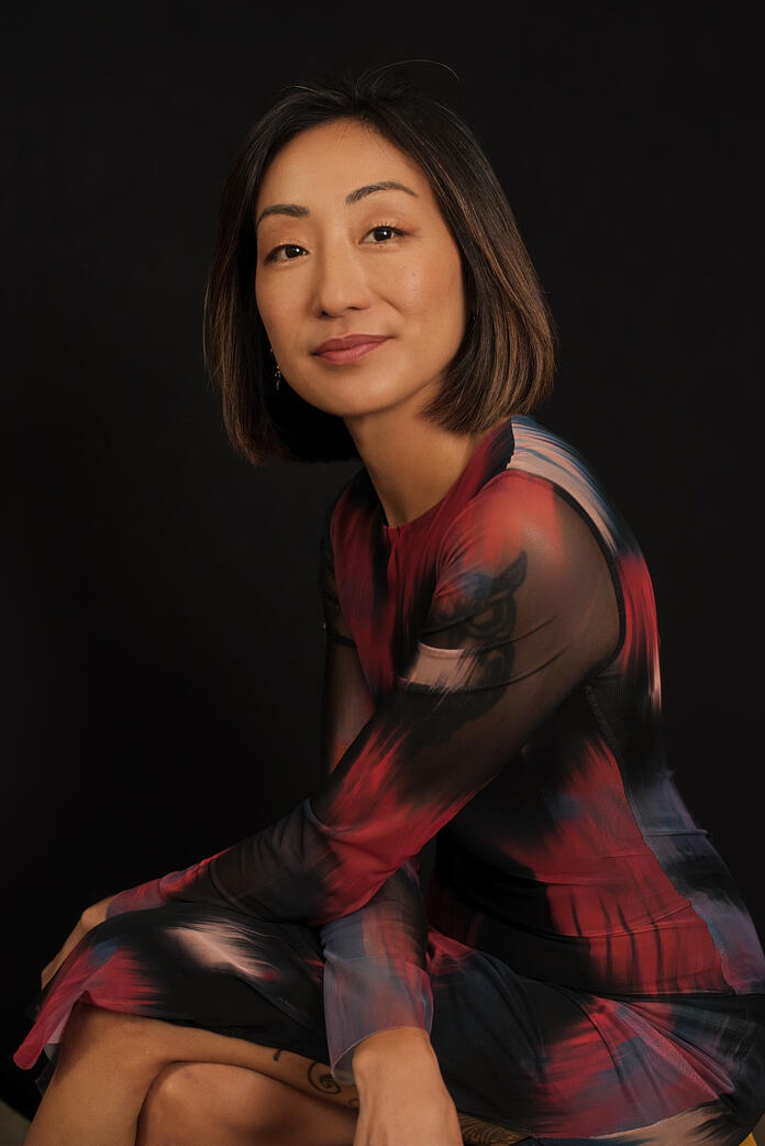 Photo of asian woman in sleek dress, Berlin studio photoshoot